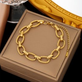 TA309 Lắc tay titan khoen ovan xoắn mạ màu vàng