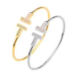 TV122 Vòng tay titan nữ 2 chữ T ngược đính đá và xà cừ Tiffany