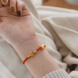 TV138 Vòng tay titan da đỏ kim tiền may mắn