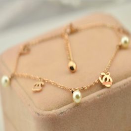 TA567 Lắc chân nữ titan ngọc trai cách điệu chanel vàng hồng